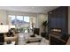 Bright living room with fireplace, sliding doors to balcony with mountain view at 18720 N 101St St # 3006, Scottsdale, AZ 85255