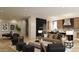 Open-concept living area with modern furnishings, wine storage, and a seamless flow to the kitchen space at 18720 N 101St St # 3006, Scottsdale, AZ 85255