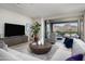 Cozy living room with sliding glass doors to balcony, offering stunning mountain views and ample natural light at 18720 N 101St St # 3006, Scottsdale, AZ 85255