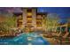 Beautiful pool with lounge chairs offering a relaxing oasis with a stunning building in the background at 18720 N 101St St # 3006, Scottsdale, AZ 85255