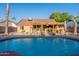 Enjoy this backyard pool and covered patio with plenty of space for entertaining at 19440 N 12Th St, Phoenix, AZ 85024