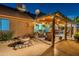 Serene backyard features a covered patio, decorative water feature, and charming landscaping at 19440 N 12Th St, Phoenix, AZ 85024