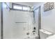 Bathroom features tile shower with glass door and modern fixtures at 19440 N 12Th St, Phoenix, AZ 85024