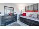 Comfortable bedroom features a storage daybed, dresser with mirror, and stylish decor at 19440 N 12Th St, Phoenix, AZ 85024