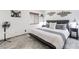 Cozy bedroom with stylish decor, wood-look floors, and ample natural light at 19440 N 12Th St, Phoenix, AZ 85024