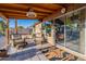 Relax on this covered patio with wicker furniture and views of the landscaped yard at 19440 N 12Th St, Phoenix, AZ 85024