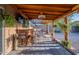 This covered patio features an outdoor bar area, perfect for enjoying the backyard at 19440 N 12Th St, Phoenix, AZ 85024
