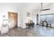 Inviting entryway with decorative wood door and stylish wood-look flooring at 19440 N 12Th St, Phoenix, AZ 85024