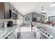 Bright kitchen with granite countertops, stainless appliances, and an open floor plan at 19440 N 12Th St, Phoenix, AZ 85024