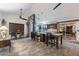 Spacious open-concept kitchen featuring granite countertops, dark wood cabinets, and modern appliances at 19440 N 12Th St, Phoenix, AZ 85024