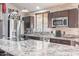 Well-equipped kitchen featuring stainless steel appliances, granite counters, and ample cabinet space at 19440 N 12Th St, Phoenix, AZ 85024