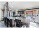 Expansive kitchen with granite counters overlooking patio and pool views at 19440 N 12Th St, Phoenix, AZ 85024