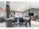 Open kitchen featuring a large island with seating and stainless steel appliances at 19440 N 12Th St, Phoenix, AZ 85024