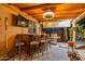 Entertaining outdoor space featuring a bar, grill, and seating under a covered patio at 19440 N 12Th St, Phoenix, AZ 85024