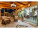 Inviting covered patio with comfortable seating and a view into the home's living area at 19440 N 12Th St, Phoenix, AZ 85024