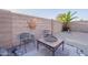 Cozy outdoor seating area with fire pit and desert-themed wall decor at 19440 N 12Th St, Phoenix, AZ 85024