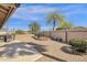Spacious backyard with mature trees, desert landscaping, and a fountain at 19791 N 86Th Dr, Peoria, AZ 85382