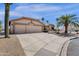 Exterior showcases a three car garage, neutral color palette, and well maintained desert landscaping at 19791 N 86Th Dr, Peoria, AZ 85382
