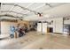 Spacious garage providing ample parking and storage with a golf cart at 19791 N 86Th Dr, Peoria, AZ 85382
