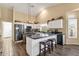 Spacious kitchen with granite countertops, an island, and stainless-steel appliances at 19791 N 86Th Dr, Peoria, AZ 85382