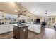 Kitchen area featuring granite counters, a kitchen island, and natural lighting at 19791 N 86Th Dr, Peoria, AZ 85382