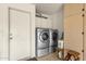 A laundry room with stainless steel washer and dryer at 19791 N 86Th Dr, Peoria, AZ 85382