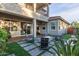 Outdoor patio featuring stylish pavers, comfortable seating, and a cozy fire pit at 21073 W Sunrise Ln, Buckeye, AZ 85396