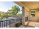 Spacious balcony offering views of lush greenery and a quiet street at 21073 W Sunrise Ln, Buckeye, AZ 85396