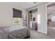 This bedroom features a walk-in closet and a window with lots of natural light at 21073 W Sunrise Ln, Buckeye, AZ 85396