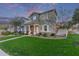 Well-manicured front yard with lush green grass and attractive landscaping at 21073 W Sunrise Ln, Buckeye, AZ 85396