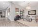 Bright living room with comfortable seating, and views into the kitchen at 21073 W Sunrise Ln, Buckeye, AZ 85396