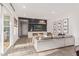 Bright living room featuring a modern fireplace, recessed lighting, and sliding glass door to the outside at 21073 W Sunrise Ln, Buckeye, AZ 85396
