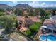 Aerial shot of beautiful home featuring an outdoor pool, meticulously landscaped backyard, and mountain views at 21538 N 59Th Ln, Glendale, AZ 85308