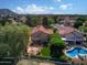 Beautiful home featuring an outdoor pool, meticulously landscaped backyard, and mountain views in the distance at 21538 N 59Th Ln, Glendale, AZ 85308