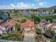 Stunning aerial view of home overlooking lush golf course and serene lake with mountain views in the background at 21538 N 59Th Ln, Glendale, AZ 85308