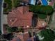 Aerial view showing home's well-maintained landscaping and the terracotta roof, along with an outdoor entertaining area at 21538 N 59Th Ln, Glendale, AZ 85308
