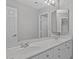 Bright bathroom featuring double sinks, a large mirror, and ample counter space at 21538 N 59Th Ln, Glendale, AZ 85308
