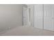 Bedroom with sliding closet doors and view through the doorway at 21538 N 59Th Ln, Glendale, AZ 85308