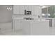 Bright kitchen featuring white cabinets, stainless steel appliances, and a tiled island at 21538 N 59Th Ln, Glendale, AZ 85308