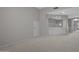 Spacious living room with neutral colors and access to a built-in bar area at 21538 N 59Th Ln, Glendale, AZ 85308
