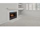 Living room featuring a fireplace, carpet, and a window with light at 21538 N 59Th Ln, Glendale, AZ 85308
