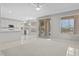 Open floor plan living room with tile floors and a large slider to the outside at 21538 N 59Th Ln, Glendale, AZ 85308