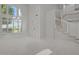 Open living room with high ceilings, large windows, a winding staircase, and neutral carpet, providing a spacious feel at 21538 N 59Th Ln, Glendale, AZ 85308