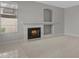 Bright living room featuring a fireplace, neutral tones, and tile floors at 21538 N 59Th Ln, Glendale, AZ 85308