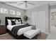 Staged main bedroom featuring a large bed, neutral decor, and ample closet space at 21538 N 59Th Ln, Glendale, AZ 85308
