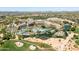 Expansive aerial view of Scottsdale resort featuring pools, lagoons, golf course, and building exteriors at 22036 N 44Th Pl, Phoenix, AZ 85050
