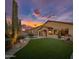 Manicured backyard featuring artificial turf, a pool and desert landscape with a playhouse at 22036 N 44Th Pl, Phoenix, AZ 85050