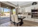 Dining area features modern lighting and views of the pool area at 22036 N 44Th Pl, Phoenix, AZ 85050