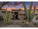 Inviting home exterior featuring desert landscaping with large saguaro cacti at 22036 N 44Th Pl, Phoenix, AZ 85050