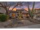 Beautiful home exterior at sunset with desert landscaping and mature saguaro cacti at 22036 N 44Th Pl, Phoenix, AZ 85050